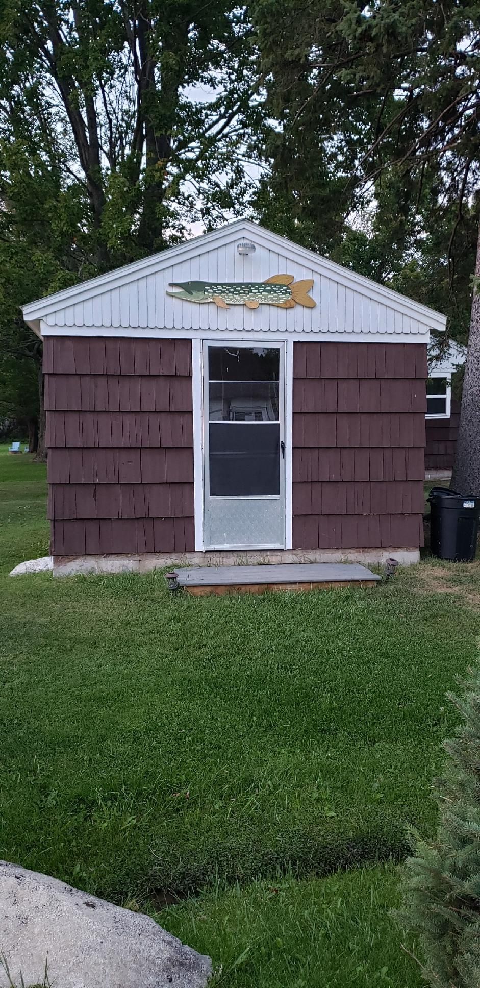 The fish cleaning house, with its carved fish sign over the door.